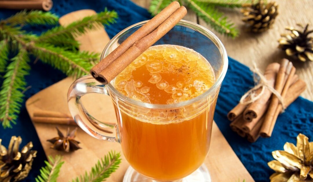 Image of a spiced orange drink with cinnamon.